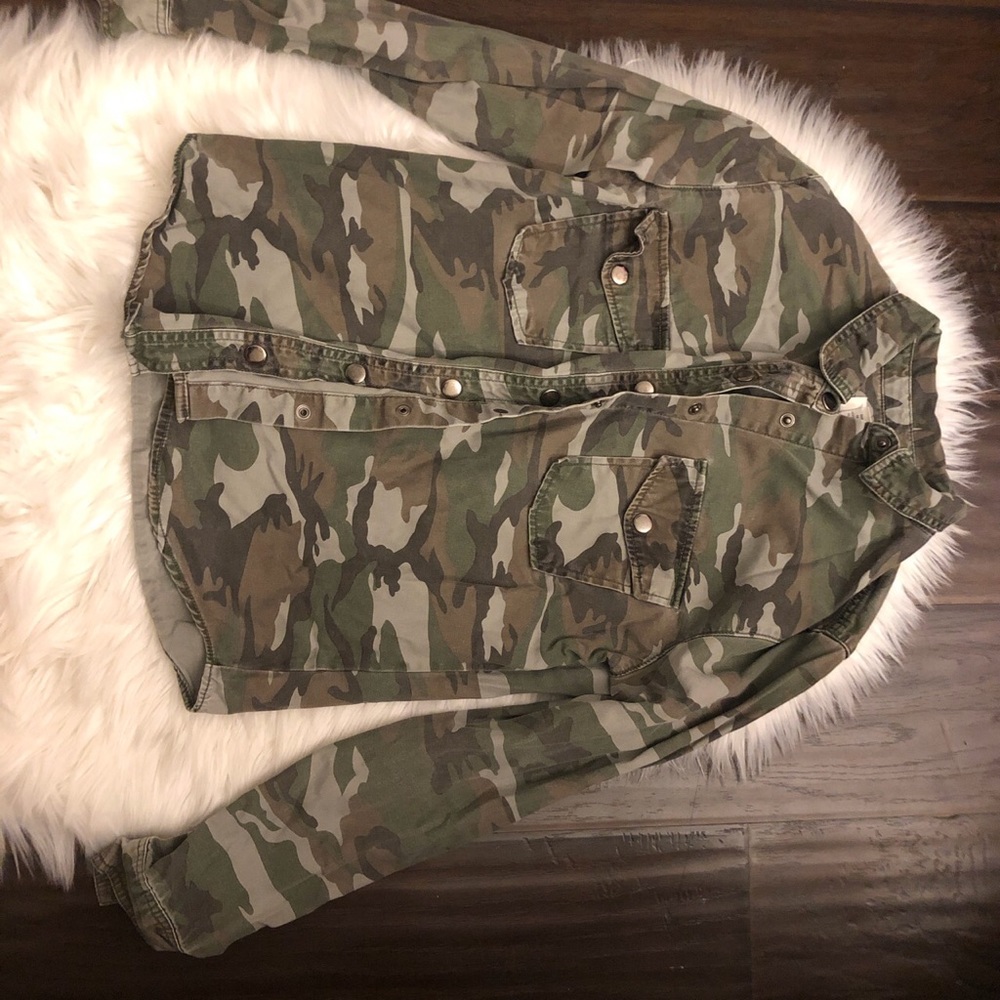 Camo button up shirt or sweater.